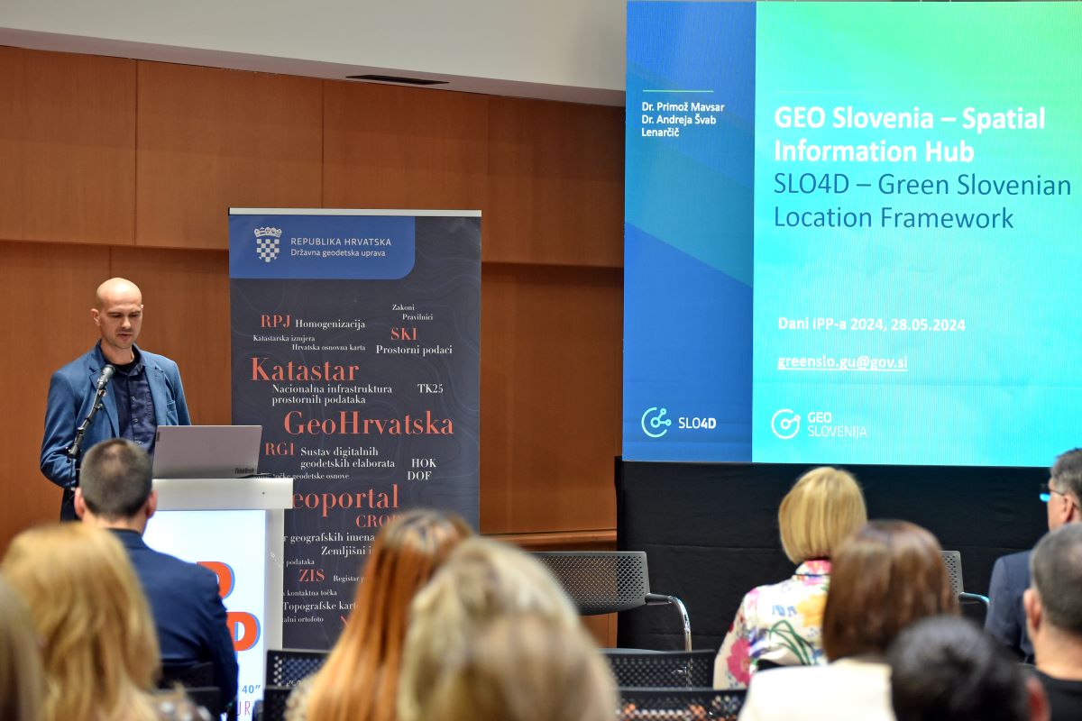 The picture shows a representative of Slovenia during the presentation of the conference "SDI Day 2024."